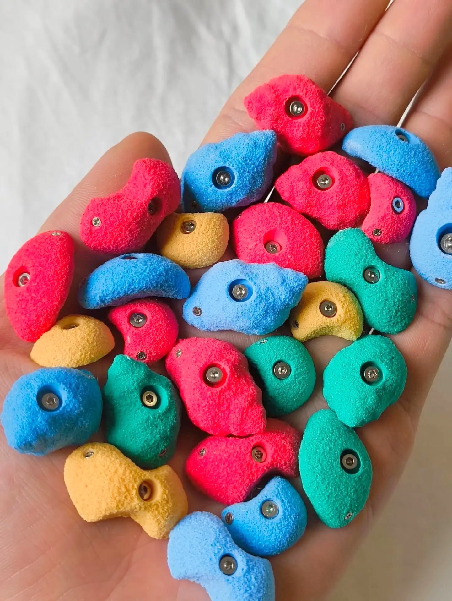 Handful of colourful miniature climbing holds